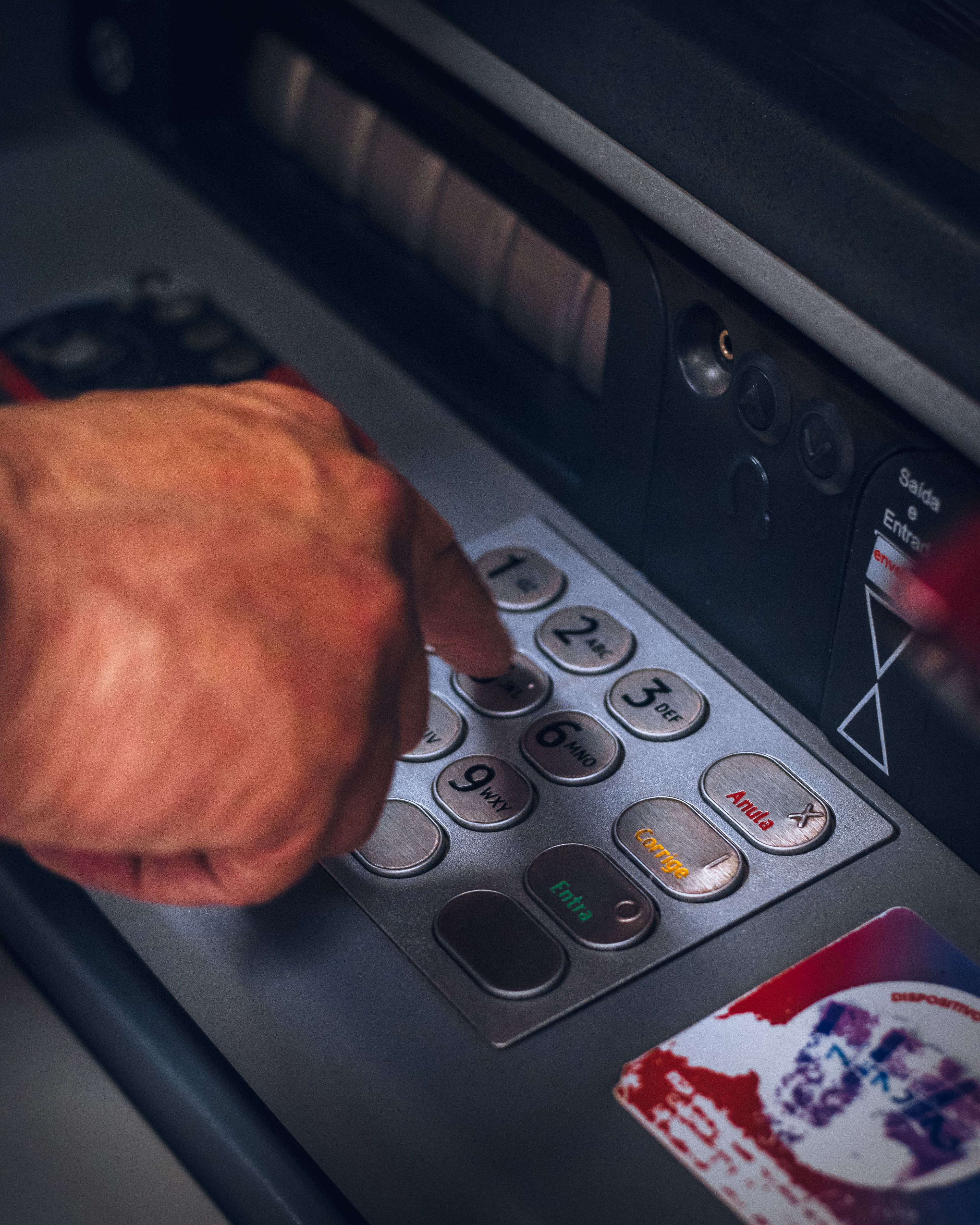 Entering a PIN on a bank keypad
