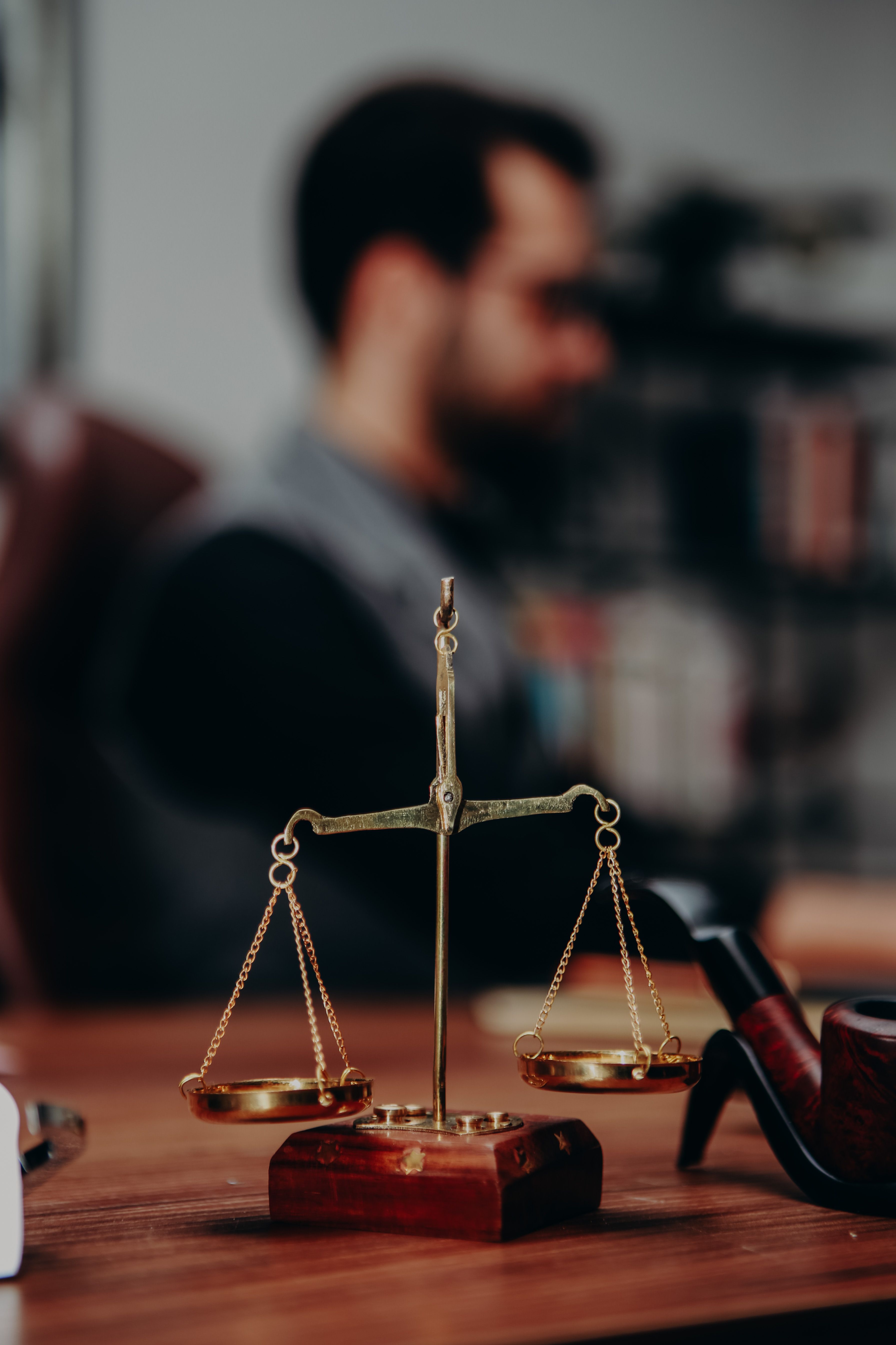 Scales of justice on a solicitor's desk